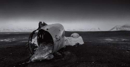 Burned plane fuselage after crash