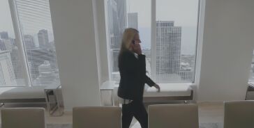 Tara Devine walking through the Chicago office